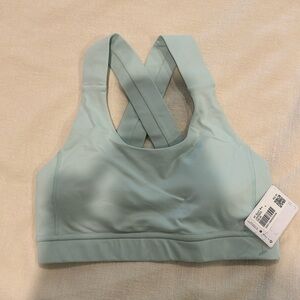 Brand new light green sports bra size 4
